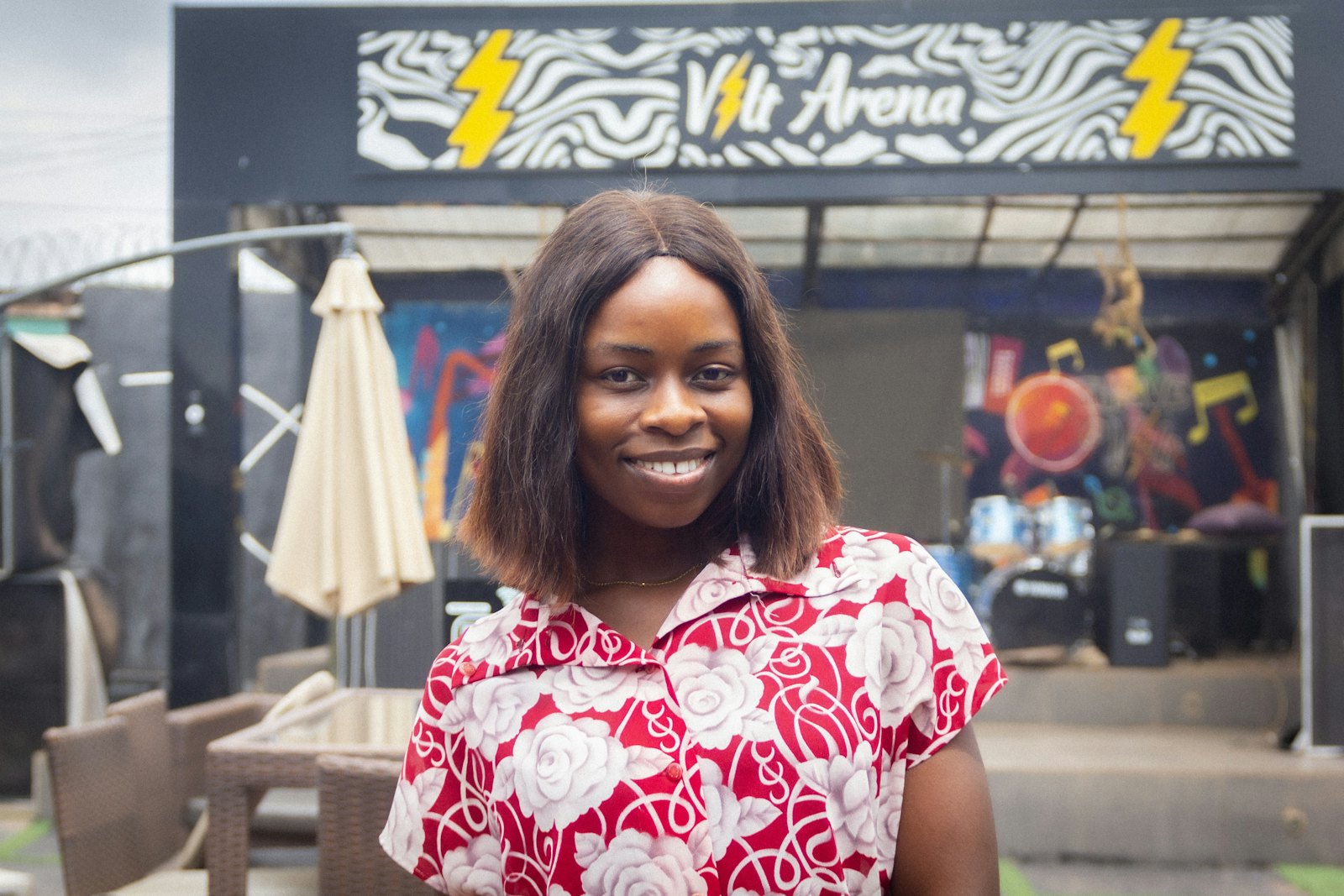 A smiling business owner outside her venue