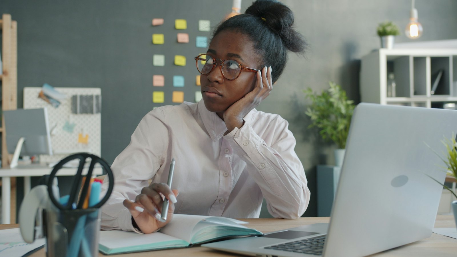 A woman planning her work at a desk